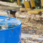 blue plastic bucket on brown wooden table