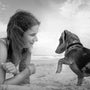 grayscale photo of woman holding dog