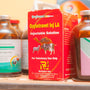 several bottles of vitamin supplements on a shelf