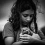 grayscale photo of woman holding dog