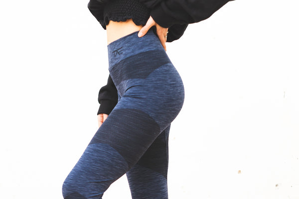 person in black long sleeve shirt and blue denim jeans