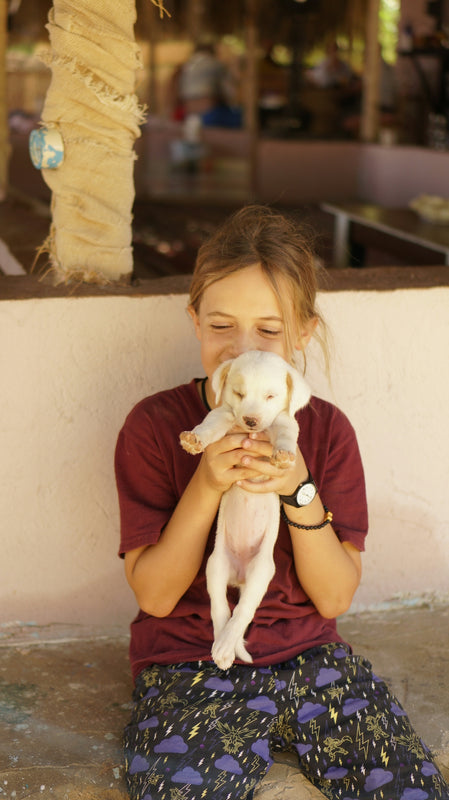 a woman holding a dog