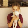 a woman holding a dog