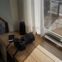 a camera sitting on a table next to a window