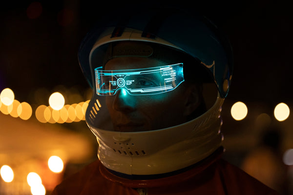 A man wearing a helmet and goggles in the dark