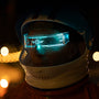 A man wearing a helmet and goggles in the dark
