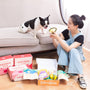 Woman and dog with treats and pawbox products.
