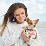 woman carrying dog close up photography