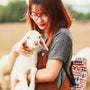 woman carrying a goat