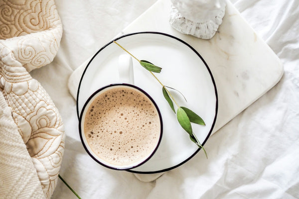 white teacup filled with coffee
