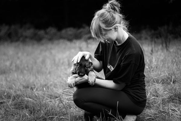 woman holding puppy