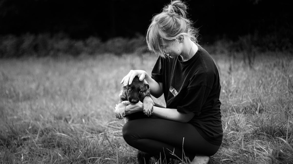 woman holding puppy