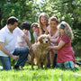group of people standing on green grass field during daytime