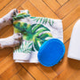 white short coated dog on green and white textile