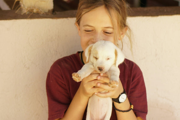 a woman holding a dog