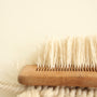a close up of a brush on a white surface