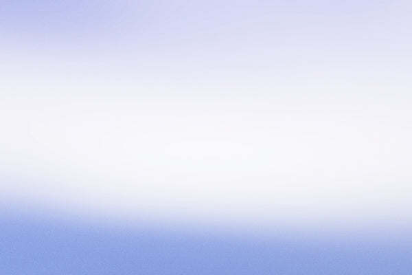 a person flying a kite in a blue sky