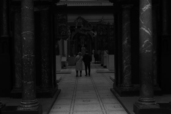 a man and a woman standing in a building