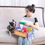 A woman and dog unpack a pawbox.