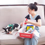 Woman opens a dog box with her dog.